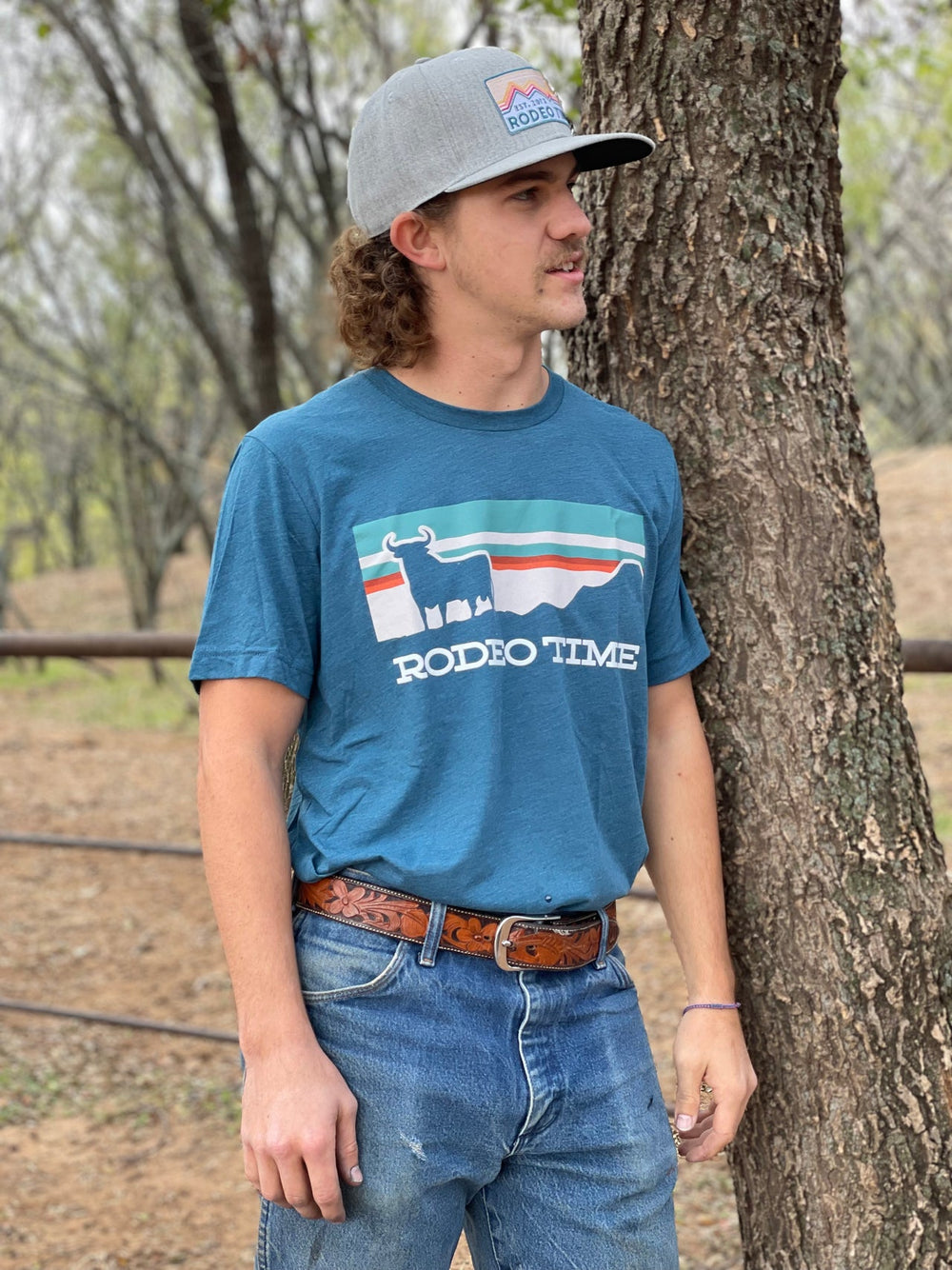 Dale Brisby Unisex T-Shirt "Sunset Rodeo Time" in Teal
